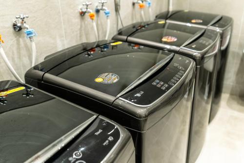 two toaster ovens sitting next to each other at Hotel The Grang Seogwipo in Seogwipo