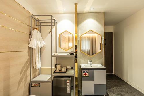 Kuchyň nebo kuchyňský kout v ubytování Hotel The Grang Seogwipo