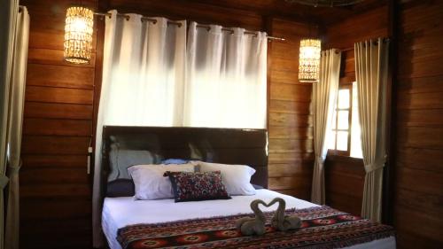 Llit o llits en una habitació de Uma Villa Manado
