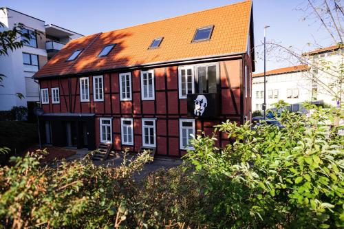 a house with a skull painted on the side of it at DWELLSTAY - Zuse Höfe Bad Hersfeld in Bad Hersfeld