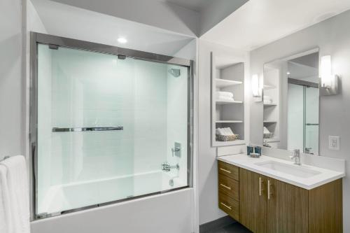 a bathroom with a glass shower and a sink at S Park Studio nr Caltrain S Park SFO-31 in San Francisco