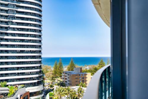 a view of the ocean from a balcony of a building at Oracle Resort Broadbeach - GCLR in Gold Coast