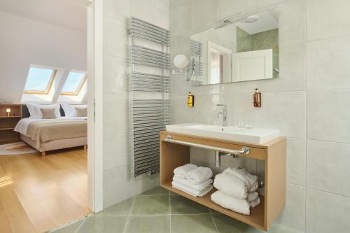 a bathroom with a sink and a mirror at Palace Natali in Dubrovnik