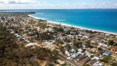 an aerial view of a town next to the beach at Bliss - seaside retreat in Callala Beach