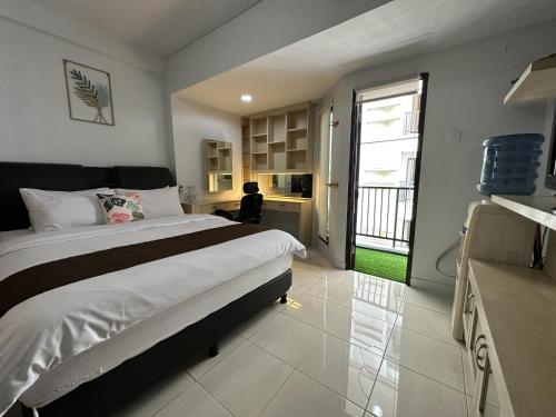 Postel nebo postele na pokoji v ubytování Apartment Taman Sari - Travelnesian Home