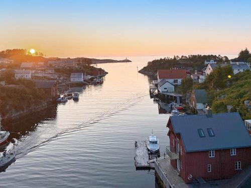 a view of a river with boats in a town at 8 person holiday home in averøy-By Traum in Averoy