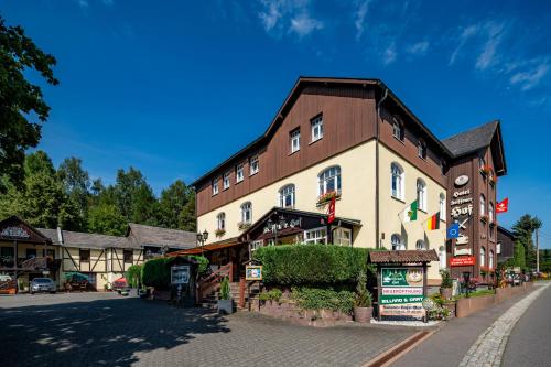 a large building on the side of a street at Hotel Seiffener Hof*** in Seiffen