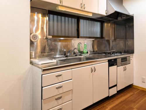 Η κουζίνα ή μικρή κουζίνα στο Ostay Numabukuro Hotel Apartment
