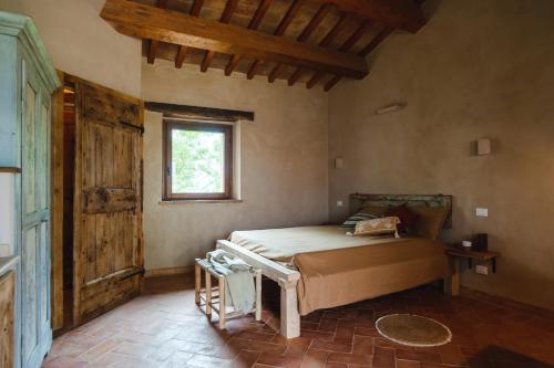 מיטה או מיטות בחדר ב-Agriturismo Borgo Malva'