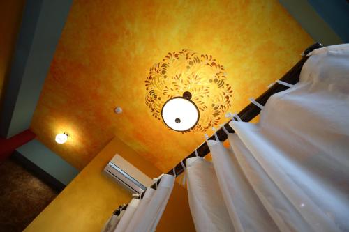 a bedroom with a bed and a light on the ceiling at Sweet Heart B&B in Jian