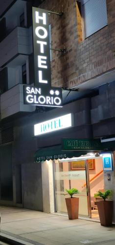 a hotel sign on the side of a building at Hotel San Glorio in Santander