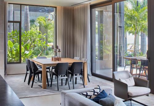 a dining room with a table and chairs at YAMA Resort in Kibbutz Ginnosar