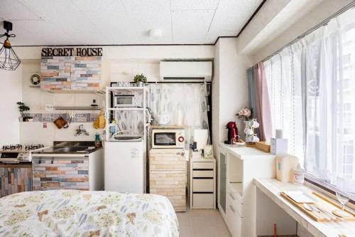 Un pat sau paturi într-o cameră la 201 Near Ueno Sunny house