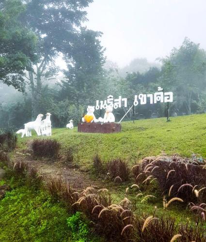 a group of statues of horses on a field at เนริสารีสอร์ท เขาค้อ in Ban Khao Ya Nua