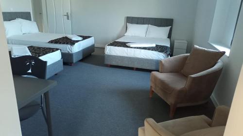 Postel nebo postele na pokoji v ubytování RED FLAG HOTEL
