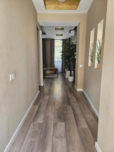 an empty hallway with wood flooring in a home at Laci Lak Premium apartment in Oradea