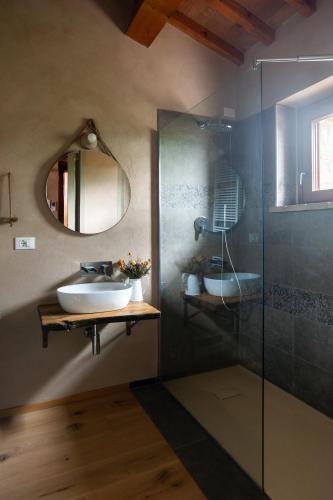 a bathroom with a sink and a glass shower at Agriturismo Borgo Malva' in San Venanzo