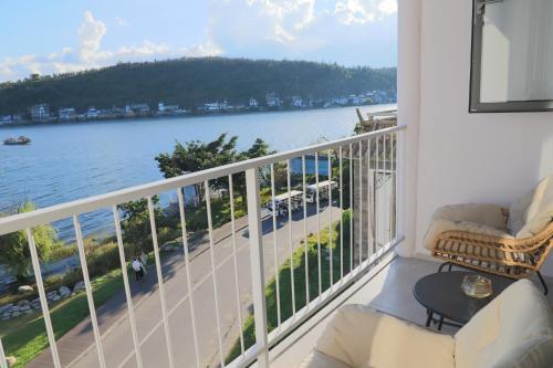 a balcony with a view of the water at Dali Fish Inn Sea View Hotel in Dali