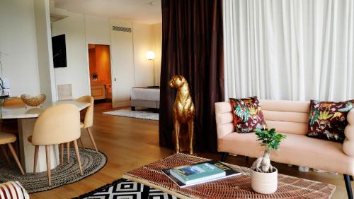 a living room with a couch and a table at La Côte Saint Jacques in Joigny
