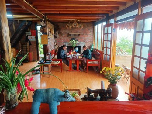 a group of people sitting at a table in a room at Sapa's Soul in Sa Pa