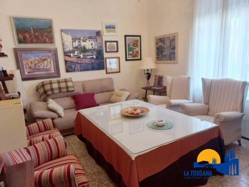 a living room with a couch and a table at La Toscana de Letur in Letur