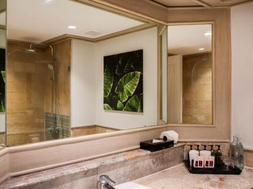 a bathroom with a sink and a shower at Beyond Kata in Kata Beach