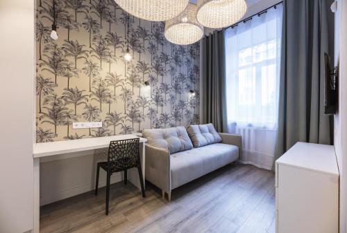 a living room with a couch and a table at Partner Guest House Baseina in Kyiv