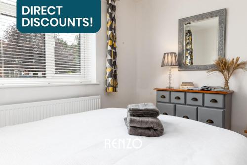 a bedroom with a bed with a mirror and a dresser at Cosy 1-bed Annexe in West Bridgford, Nottingham by Renzo, Free Driveway Parking! in Nottingham