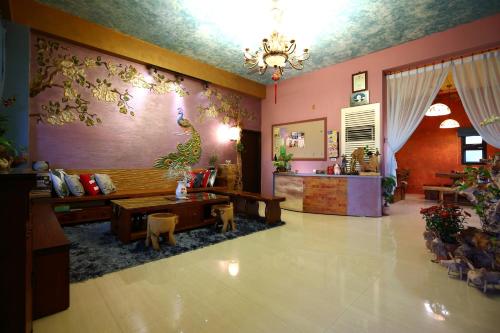 a living room with a couch and a table at Sweet Heart B&B in Jian