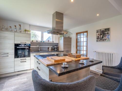 a kitchen with a table and chairs in a kitchen at Holiday Home Ty Manolo by Interhome in Tregueux