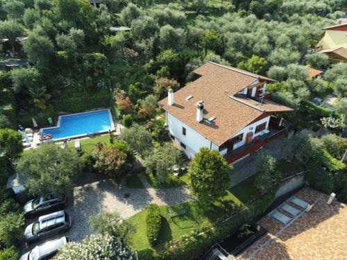 an aerial view of a house with a swimming pool at Apartment Delvai-1 by Interhome in Brenzone sul Garda