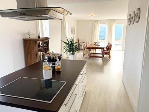 a kitchen with a black counter top in a room at Villa Renata Mit außen Pool in Čapljina