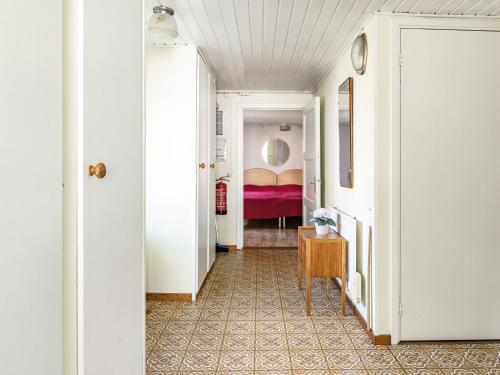 a hallway with a room with a bed at Holiday Home Bredasjö by Interhome in Gnitteryd