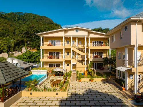 an aerial view of a building with a swimming pool at Tropical Hideaway in Beau Vallon