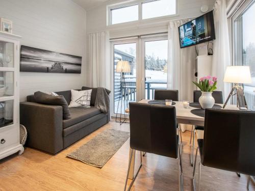 a living room with a couch and a table at Holiday Home Willa anna b by Interhome in Dragsfjärd