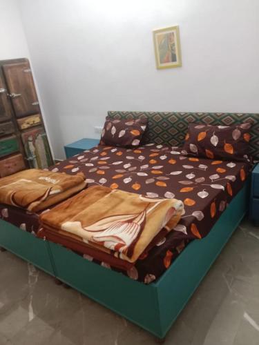 a bed in a room with at Private room in Retreat by Walias Farm Stay in Sohna