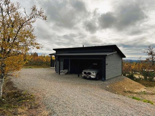 a car is parked inside of a garage at Holiday Home Villa viima by Interhome in Saariselka