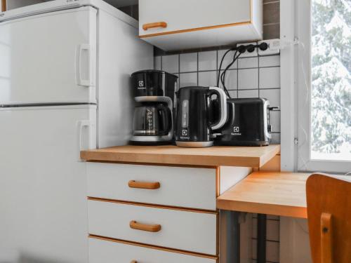 Kuchyň nebo kuchyňský kout v ubytování Holiday Home Villa latva by Interhome