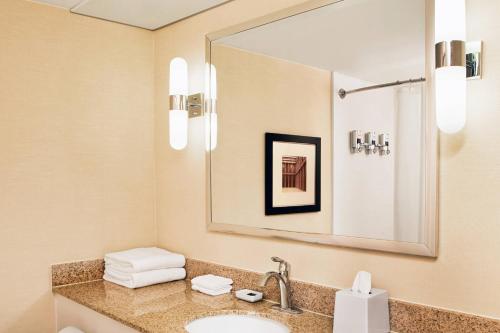 a bathroom with a sink and a mirror at Four Points Nashville - Brentwood in Brentwood
