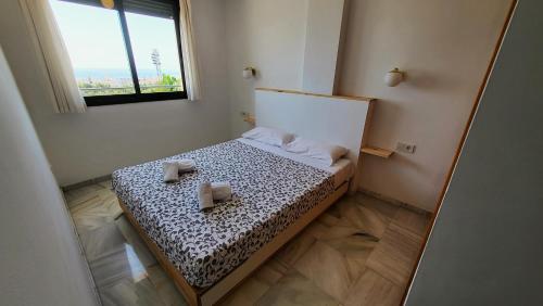 Säng eller sängar i ett rum på Apartment Mar de Nerja Beach
