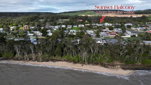 an aerial view of a beach with houses at Sunset Balcony Bass Coast Beach House in Grantville