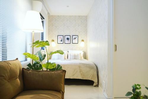 Кровать или кровати в номере Roppongi Place