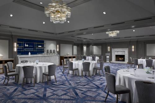 a banquet room with tables and chairs and a fireplace at The Ritz Carlton, Pentagon City in Arlington