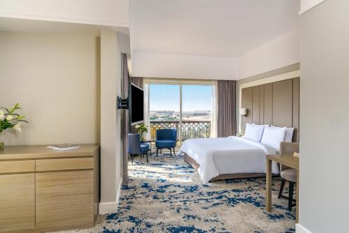 Una cama o camas en una habitación de Rixos Bab Al Bahr - Ultra All Inclusive