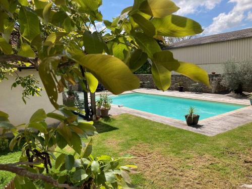 a swimming pool in the yard of a house at 38BIS Location nuit / week-end / vacances in Chaignay