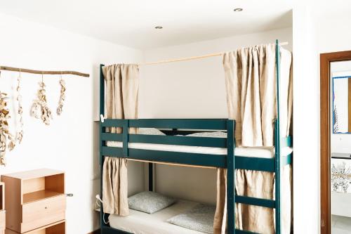 a bunk bed in a room with a window at Tamaran House in Las Palmas de Gran Canaria
