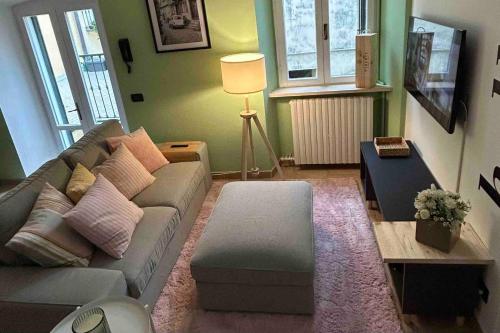 a living room with a couch and a table at the green nest in Olginate