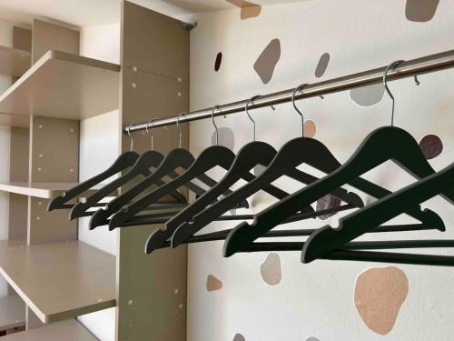 a bunch of hangers in a room at the green nest in Olginate