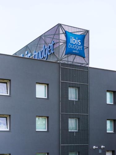 a building with a sign on top of it at Ibis Budget Sarrebourg Buhl in Sarrebourg