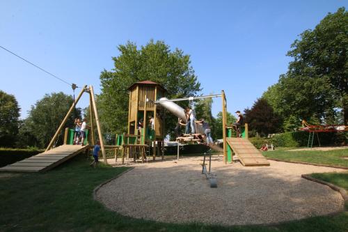 a park with a playground with a slide at Safari Tent M in Berdorf